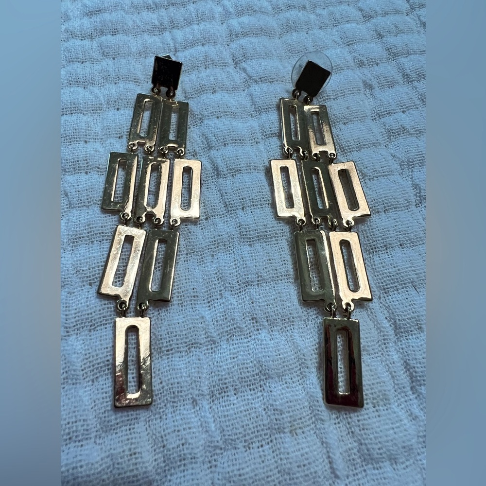 Gold chandelier earrings.